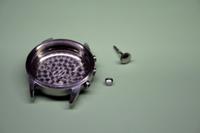 Damaged watch case with replacement pendant tube and stem