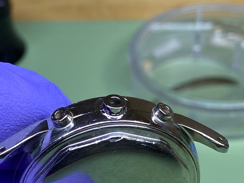 Close-up of the watch case with newly welded pendant tube